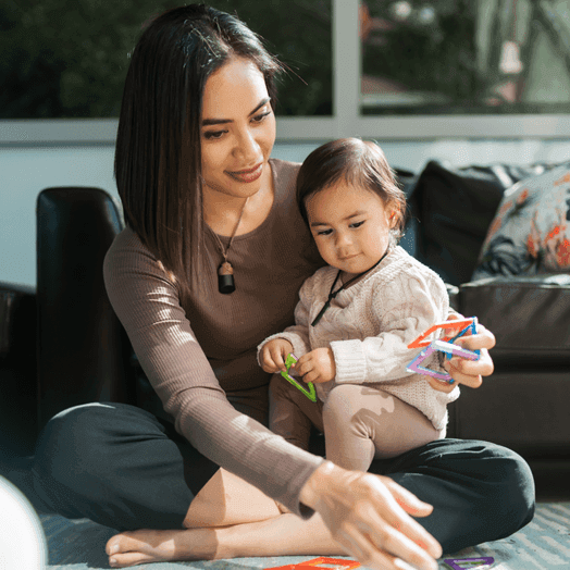 Mother and daughter playing at home